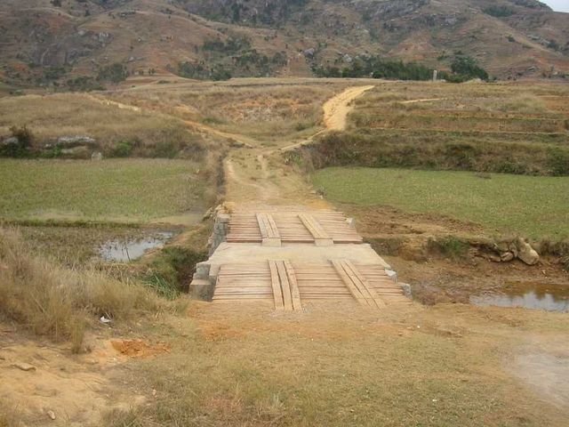 The finished bridge crossing the rice paddies