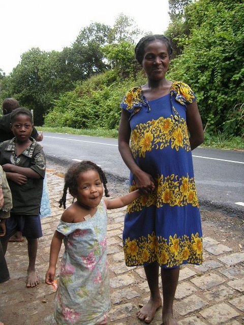 Mother and daughter by the road